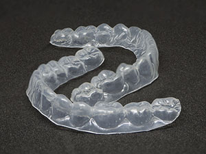 A vacuum form retainer is a removable retainer that is clear and aesthetically pleasing