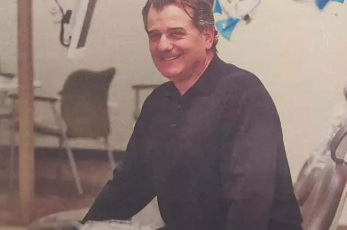 smiling-dentist-in-clinic