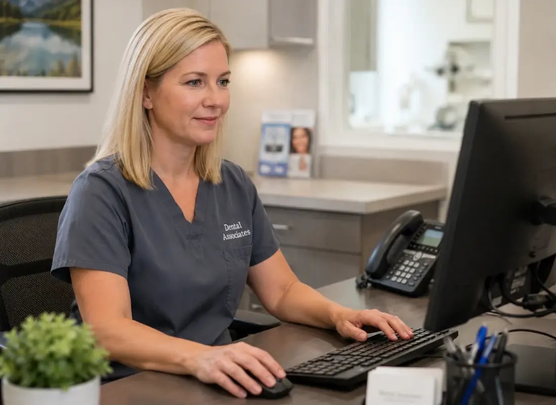 receptionist at the front desk helping with scheduling