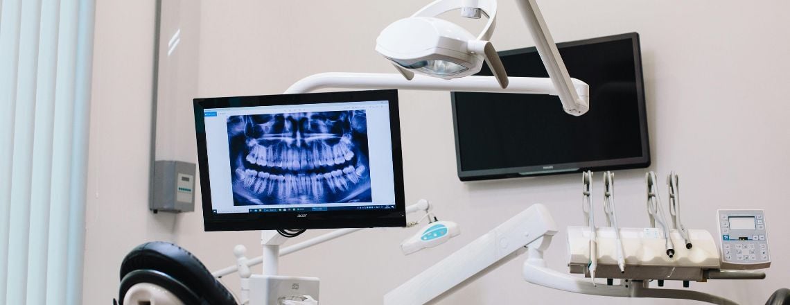 dental office with a screen showing a dental x-ray