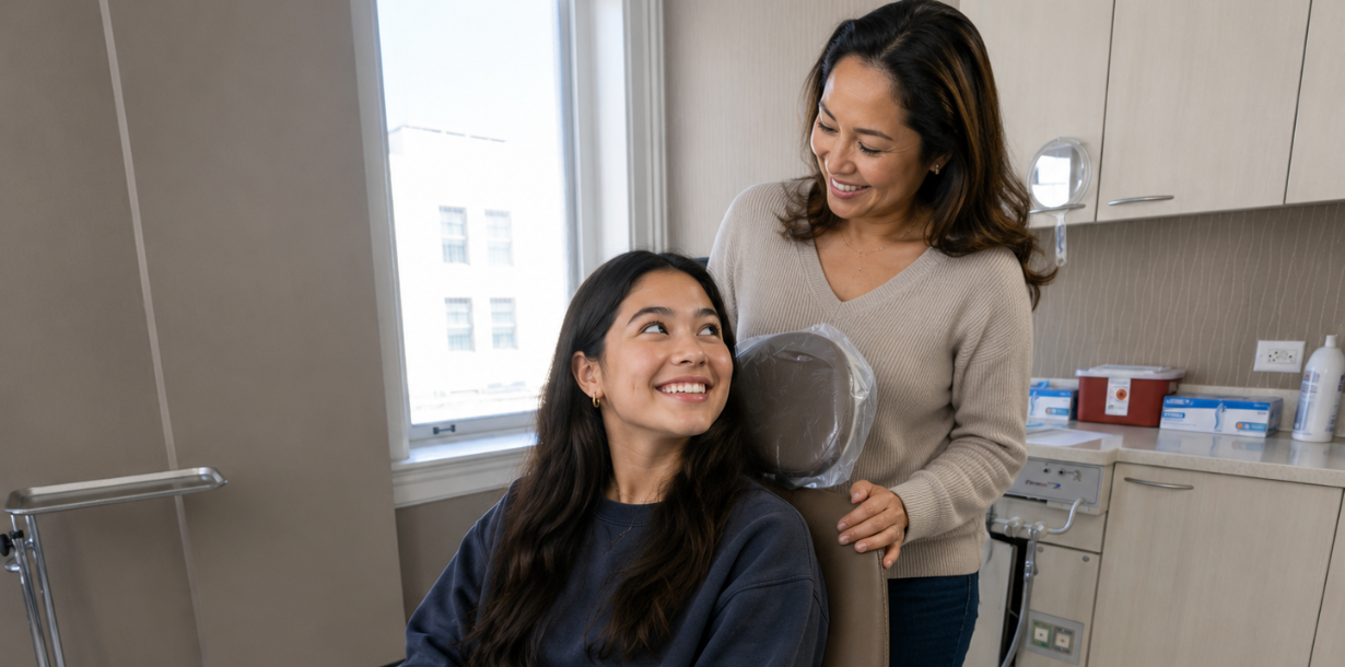 Patient smiling with mom supporting wisdom teeth surgery